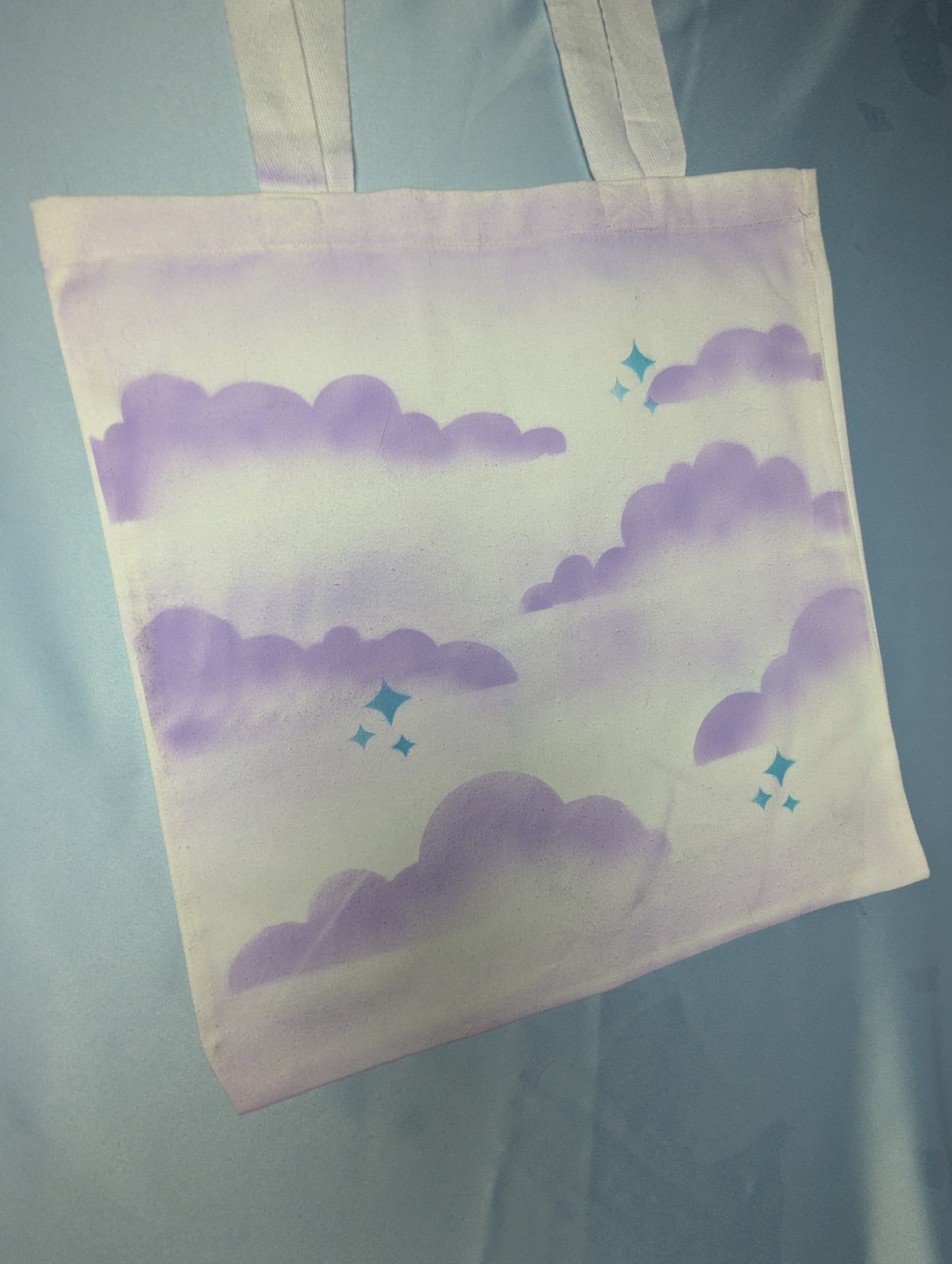 Airbrushed Clouds and Stars purple and blue tote bag